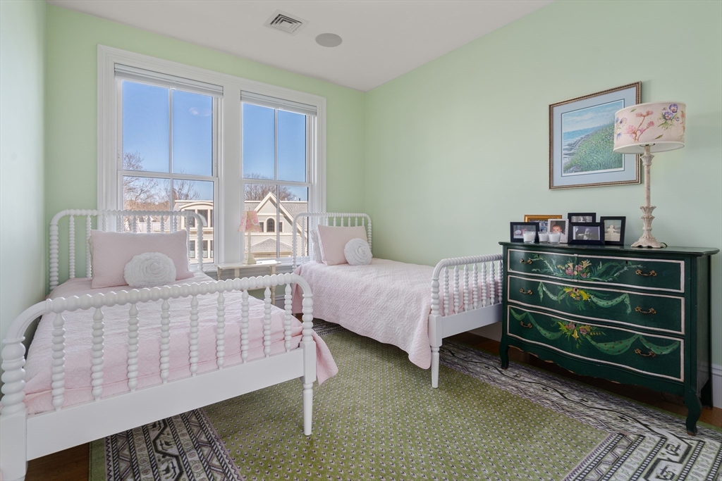 16 Everett Street, Unit 202 Boston, MA 02130 - Photo 9 of 19 a bedroom with a bed and a dresser
