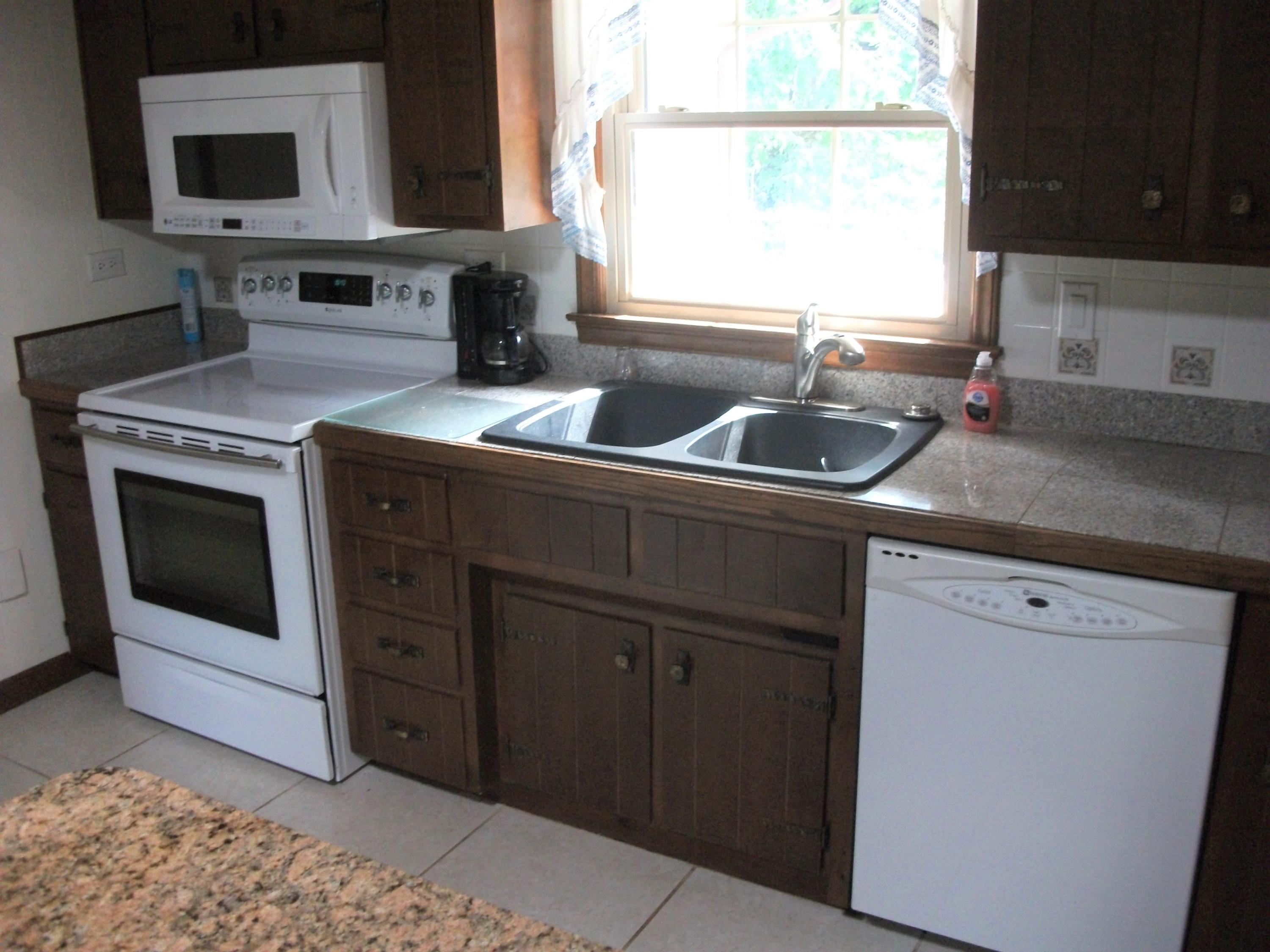 1958 Truevine Road Penhook, VA 24137 - Photo 11 of 45 a kitchen with a sink stove and microwave
