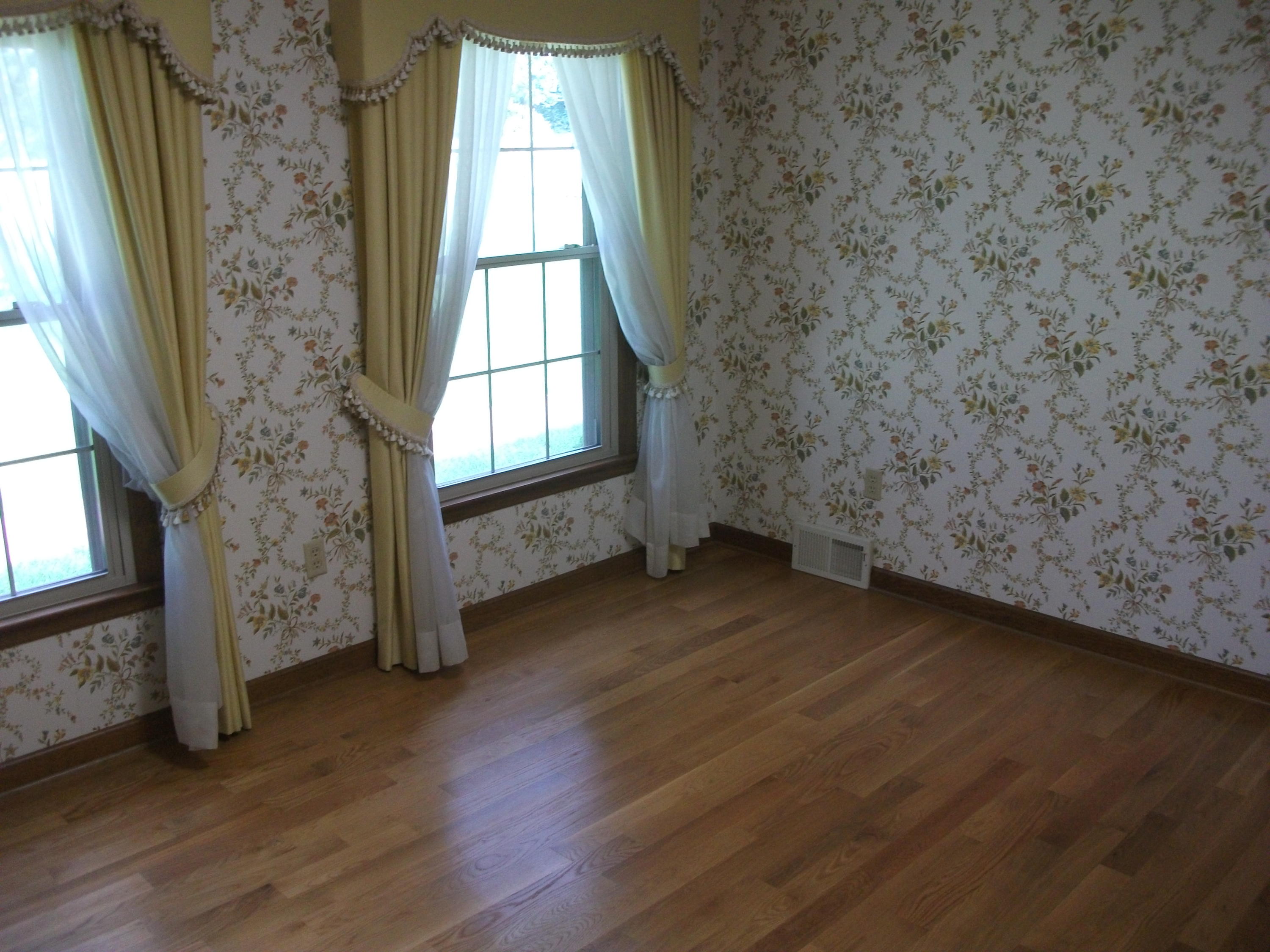1958 Truevine Road Penhook, VA 24137 - Photo 14 of 45 an empty room with wooden floor and windows