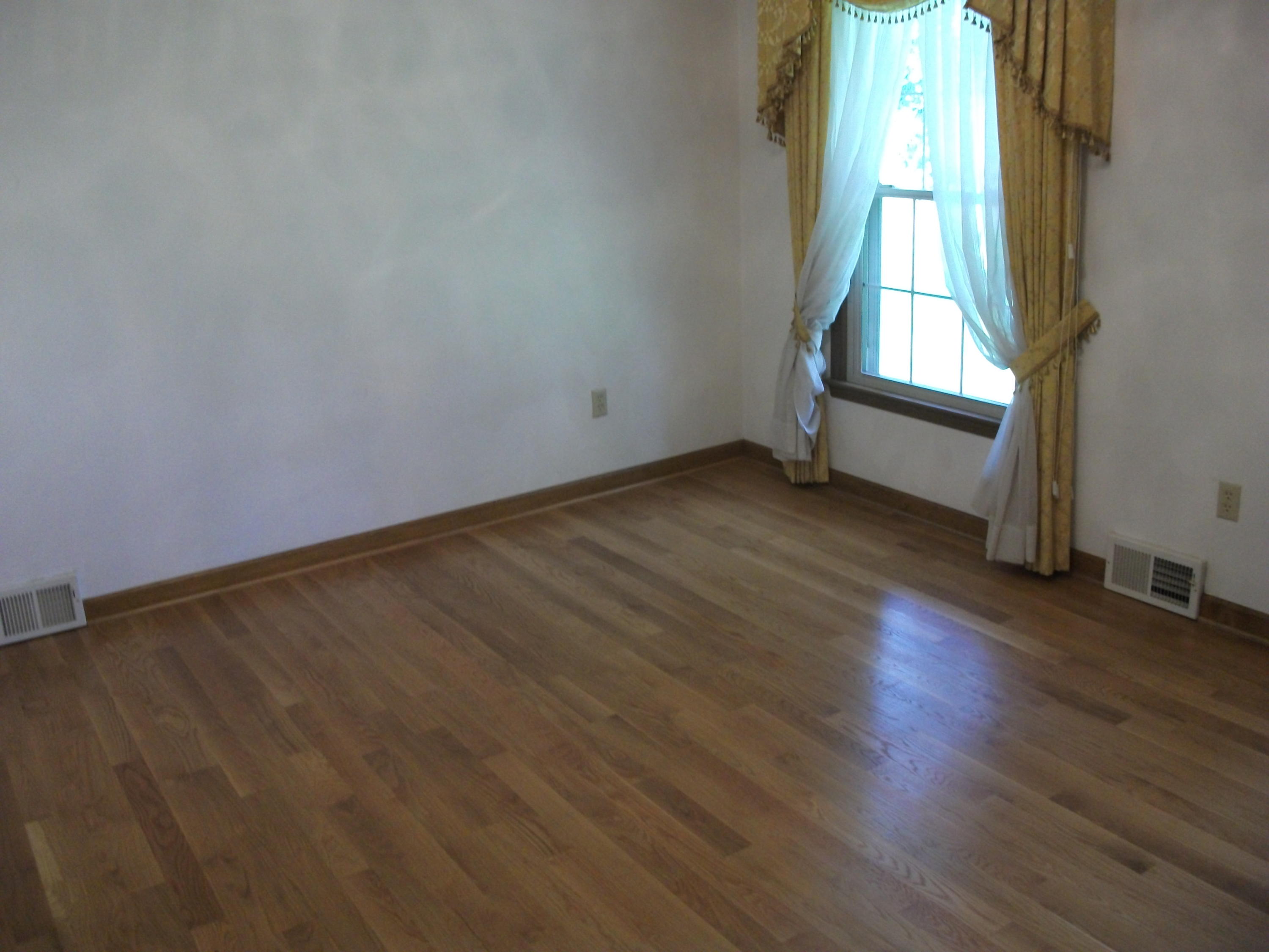 1958 Truevine Road Penhook, VA 24137 - Photo 4 of 45 an empty room with wooden floor and windows