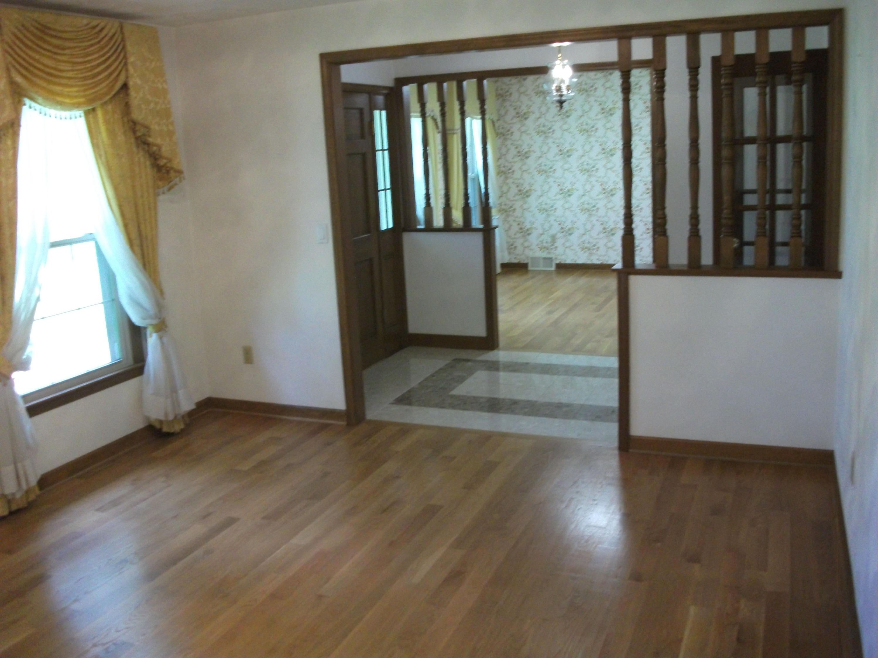 1958 Truevine Road Penhook, VA 24137 - Photo 5 of 45 an empty room with wooden floor and windows