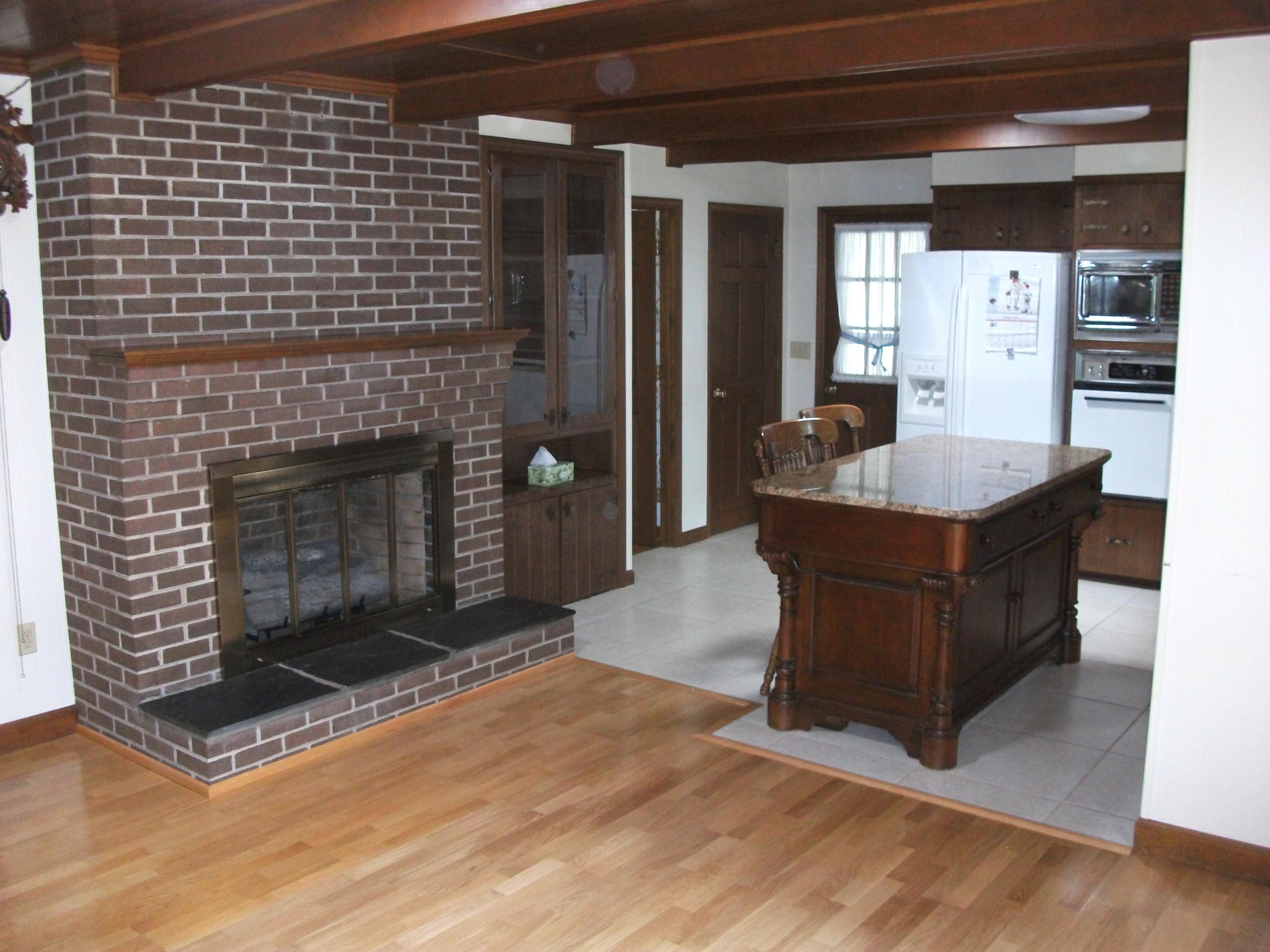 1958 Truevine Road Penhook, VA 24137 - Photo 7 of 45 a living room with furniture a fireplace and a wooden floor