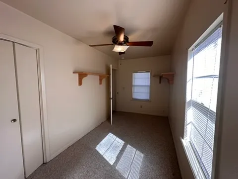 a view of a lake with houses in the back