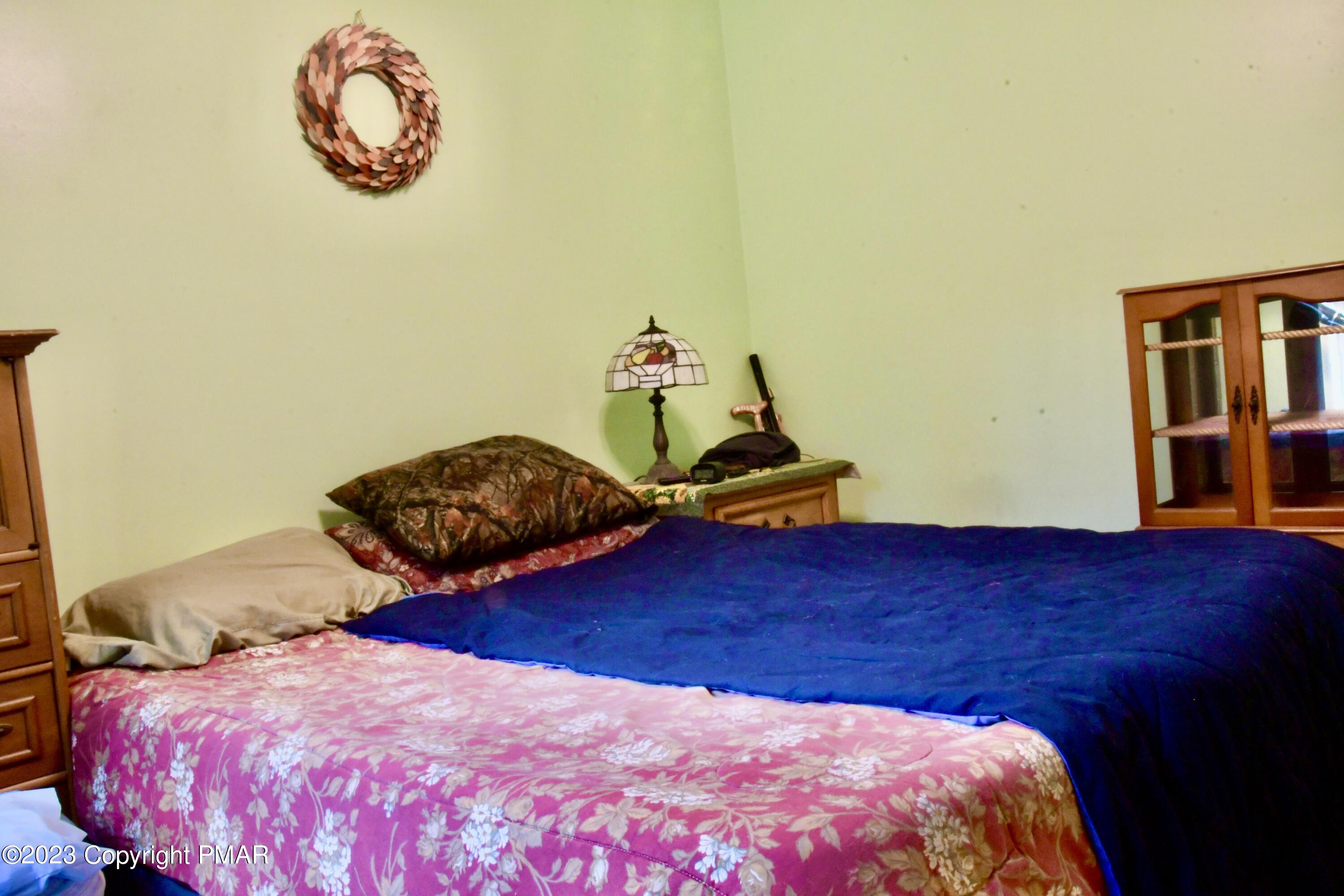 238 Schochs Mill Road Blakeslee, PA 18610 - Photo 12 of 13 a bedroom with a bed and a window