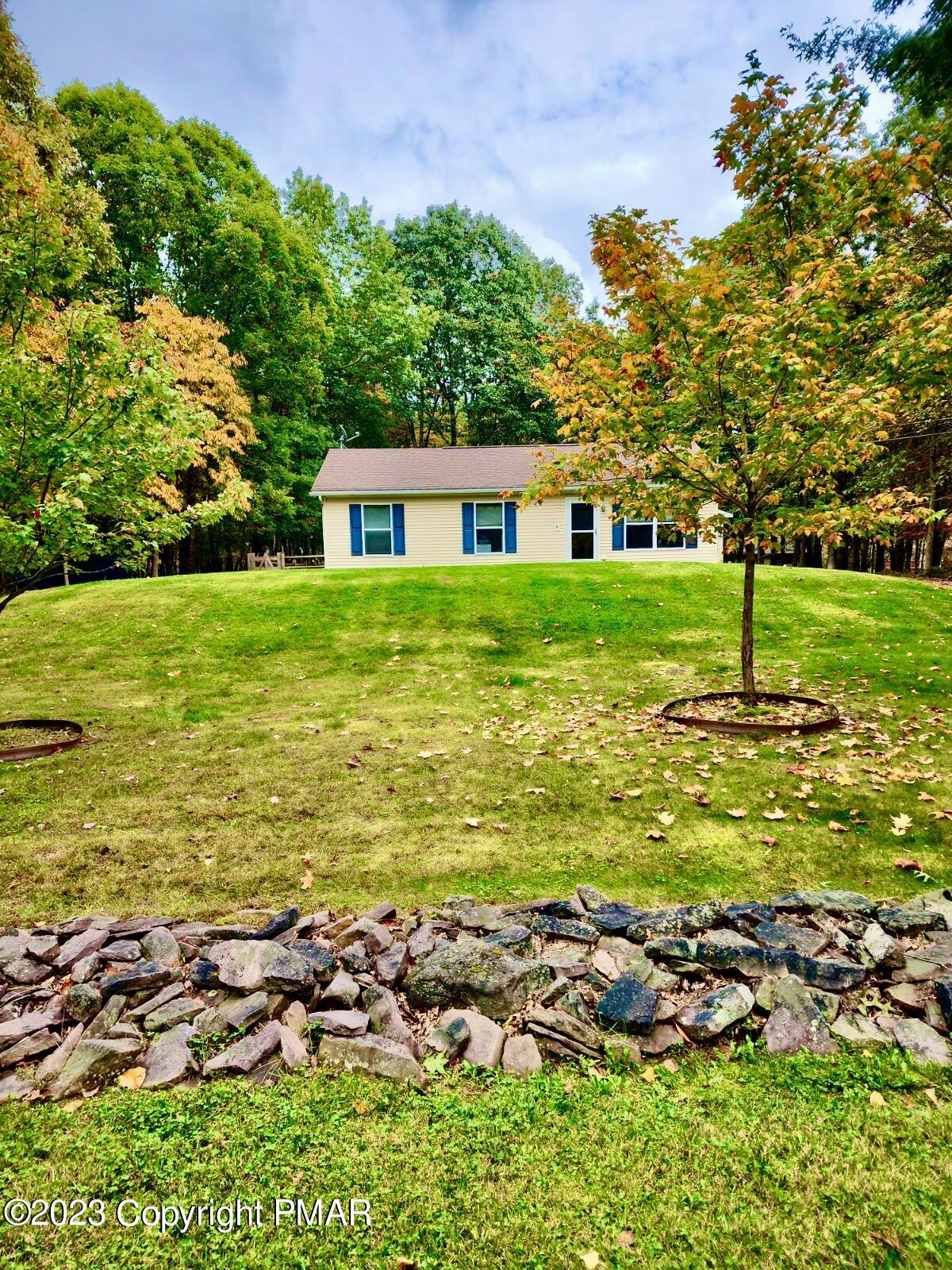 238 Schochs Mill Road Blakeslee, PA 18610 - Photo 2 of 13 a view of a house with a yard