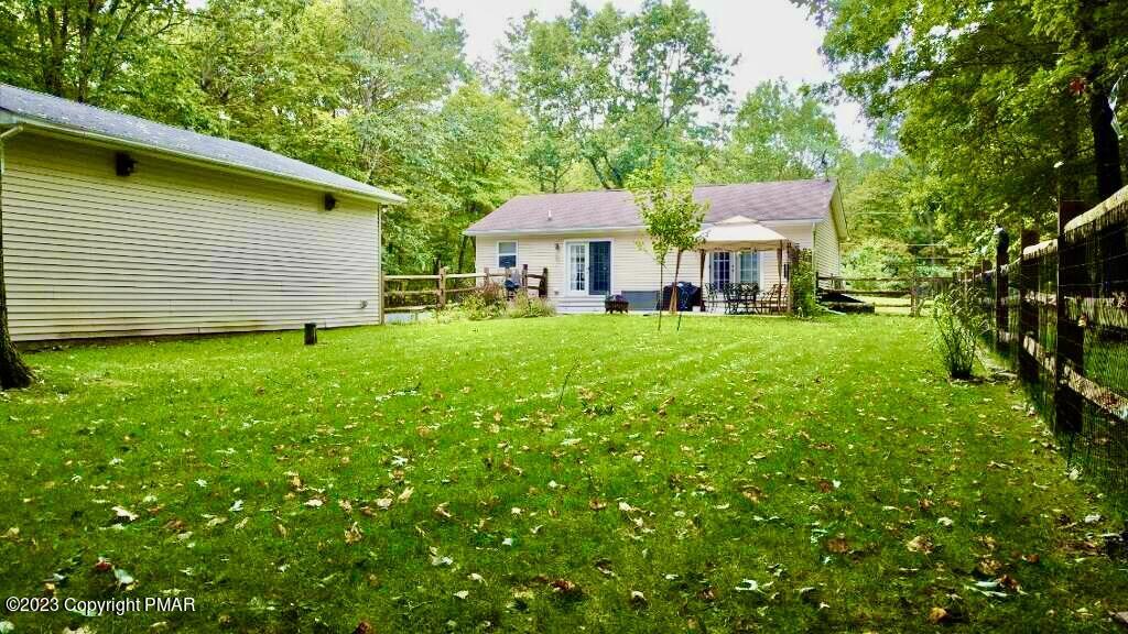238 Schochs Mill Road Blakeslee, PA 18610 - Photo 3 of 13 a view of a house with a yard and sitting area