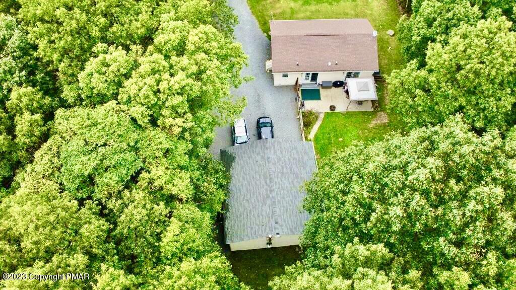 238 Schochs Mill Road Blakeslee, PA 18610 - Photo 4 of 13 an aerial view of a house with garden space and a lake view