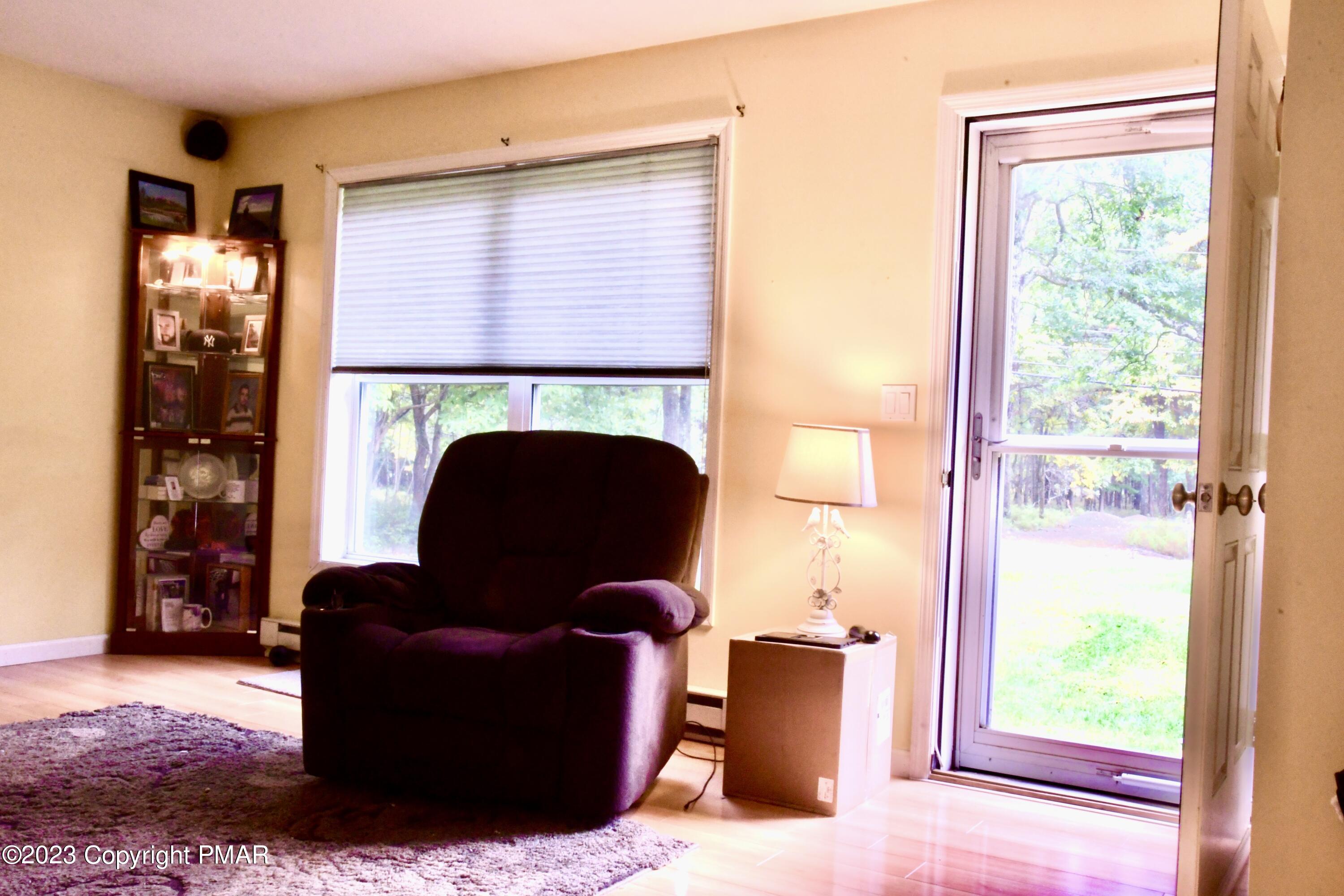 238 Schochs Mill Road Blakeslee, PA 18610 - Photo 5 of 13 a living room with furniture and a window