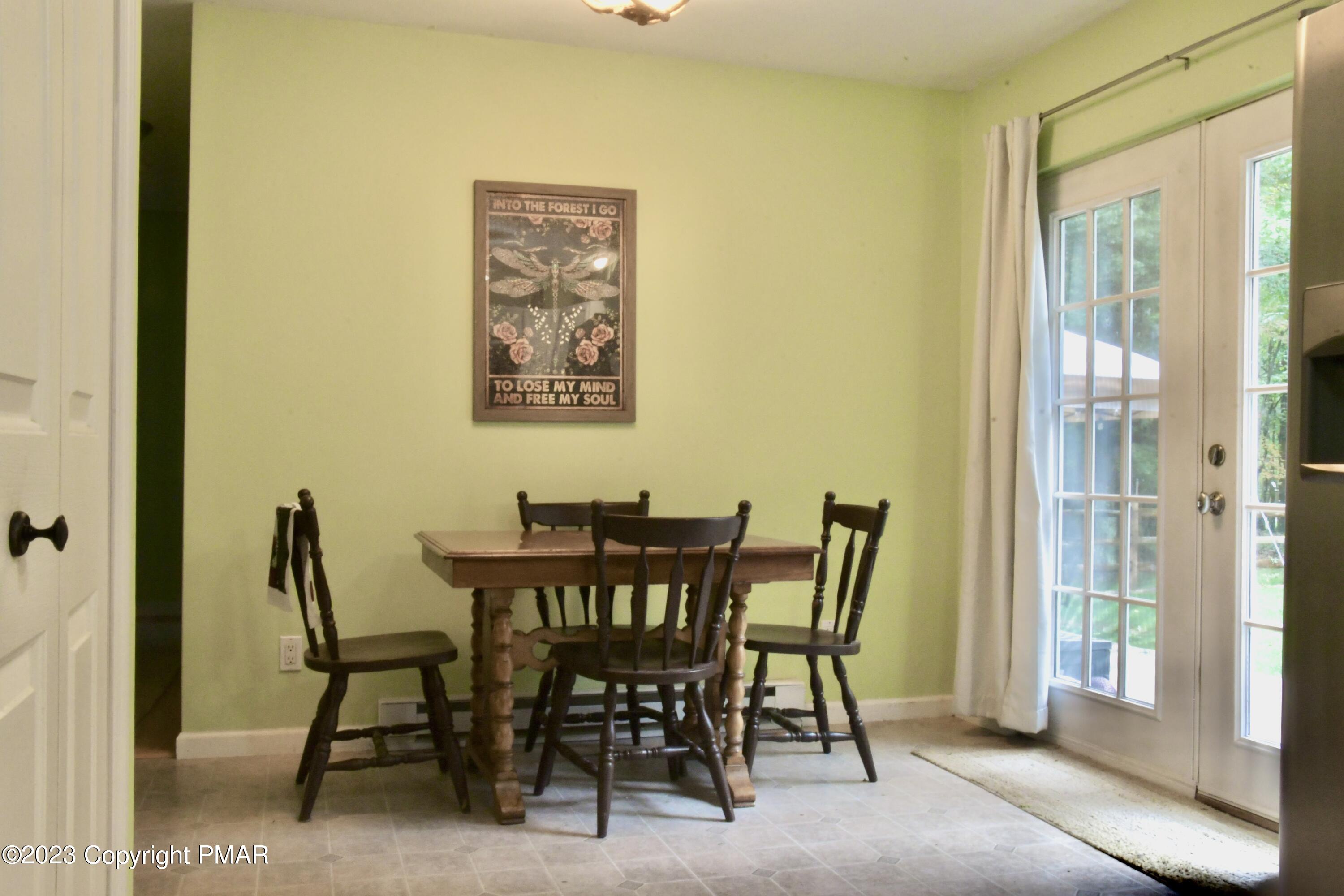 238 Schochs Mill Road Blakeslee, PA 18610 - Photo 8 of 13 a view of a dining room with furniture and a window