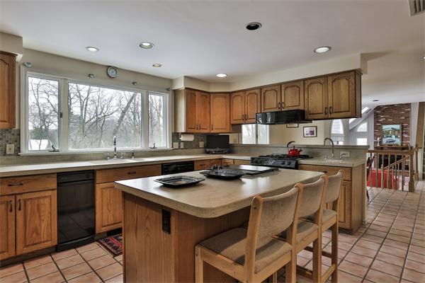 35 Lorena Road Winchester, MA 01890 - Photo 14 of 29 a kitchen with a sink a stove a refrigerator and cabinets