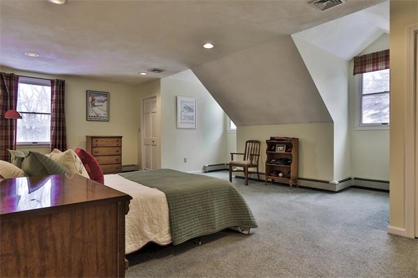 35 Lorena Road Winchester, MA 01890 - Photo 17 of 29 a bedroom with a bed a couch and large window