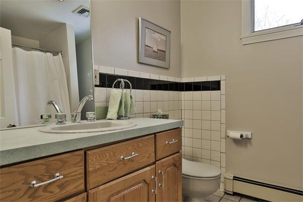 35 Lorena Road Winchester, MA 01890 - Photo 18 of 29 a bathroom with a sink toilet and shower