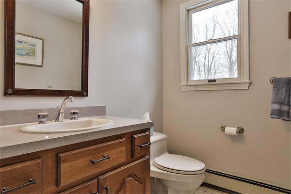 35 Lorena Road Winchester, MA 01890 - Photo 21 of 29 a bathroom with a toilet sink and mirror