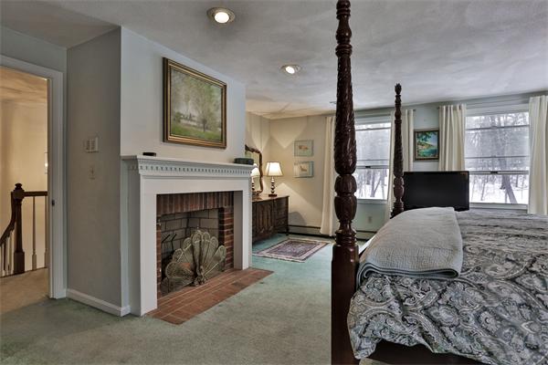 35 Lorena Road Winchester, MA 01890 - Photo 24 of 29 a living room with furniture and a fireplace