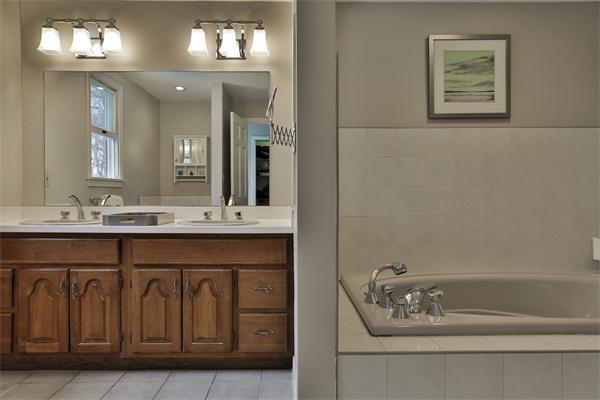 35 Lorena Road Winchester, MA 01890 - Photo 26 of 29 a bathroom with a sink a vanity and a mirror