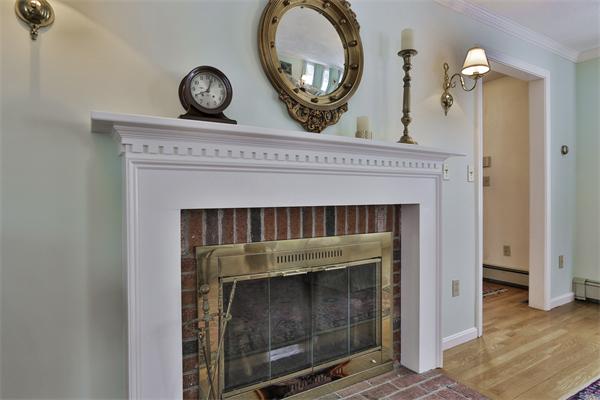 35 Lorena Road Winchester, MA 01890 - Photo 5 of 29 a view of a livingroom with a fireplace and wooden floor