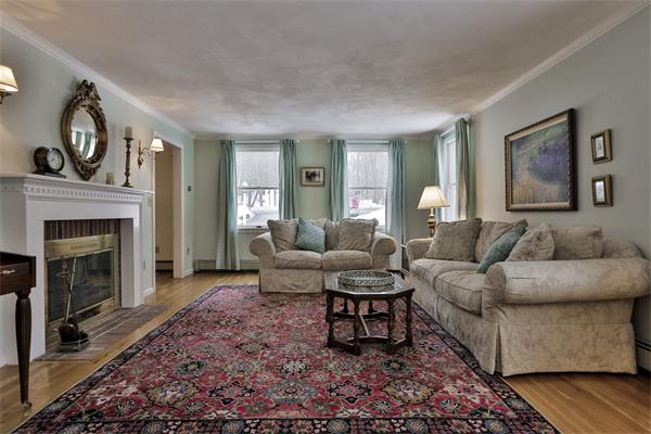 35 Lorena Road Winchester, MA 01890 - Photo 6 of 29 a living room with furniture a large window and a fireplace