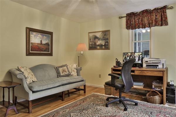 35 Lorena Road Winchester, MA 01890 - Photo 9 of 29 a living room with furniture a piano and a flat screen tv