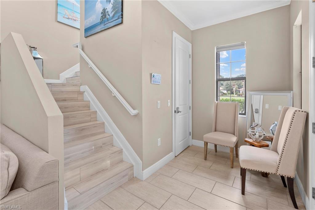 1300 Kendari Terrace Naples, FL 34113 - Photo 16 of 31 a living room with furniture and a window