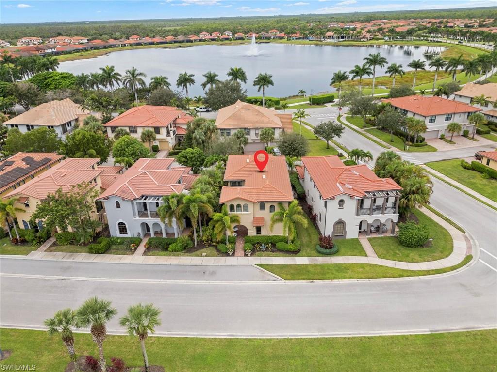 1300 Kendari Terrace Naples, FL 34113 - Photo 23 of 31 an aerial view of a house with outdoor space and lake view