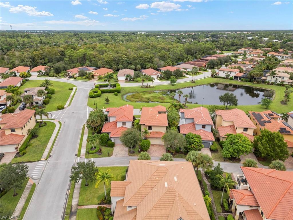 1300 Kendari Terrace Naples, FL 34113 - Photo 26 of 31 an aerial view of residential houses with outdoor space and lake view