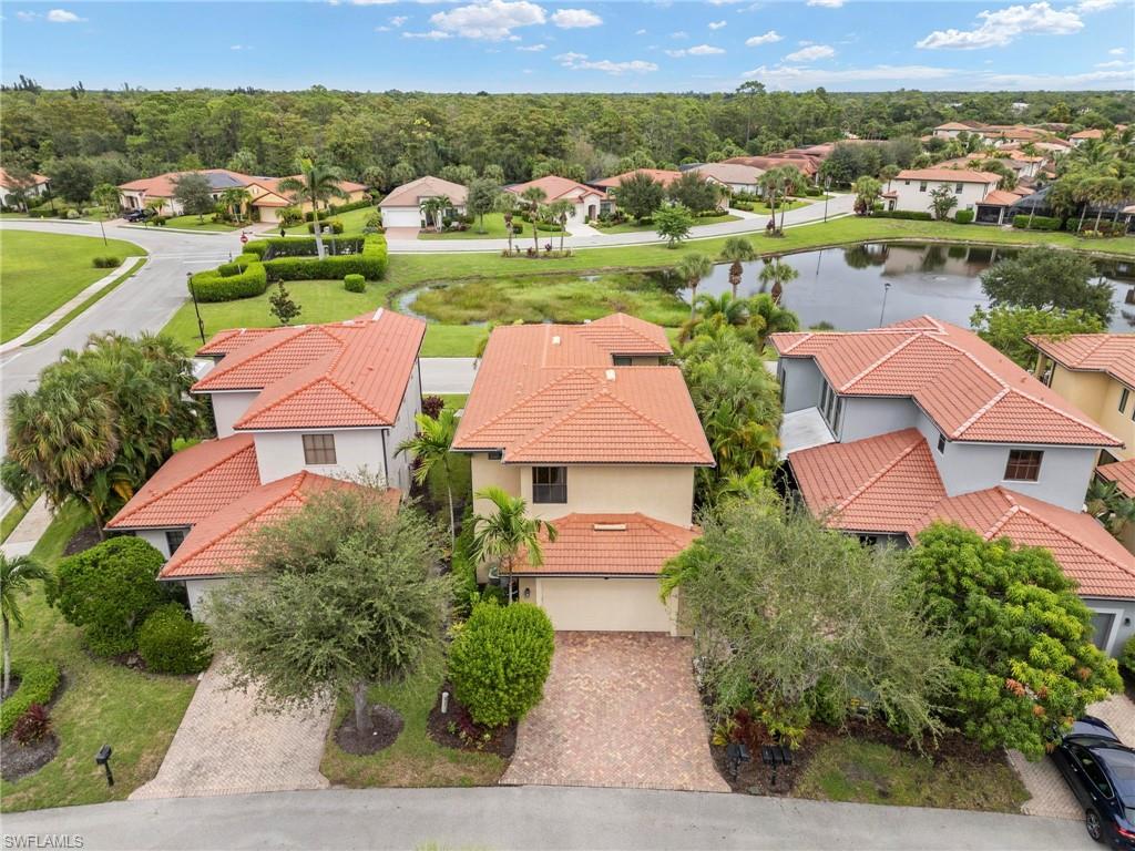 1300 Kendari Terrace Naples, FL 34113 - Photo 27 of 31 an aerial view of a houses with a lake view