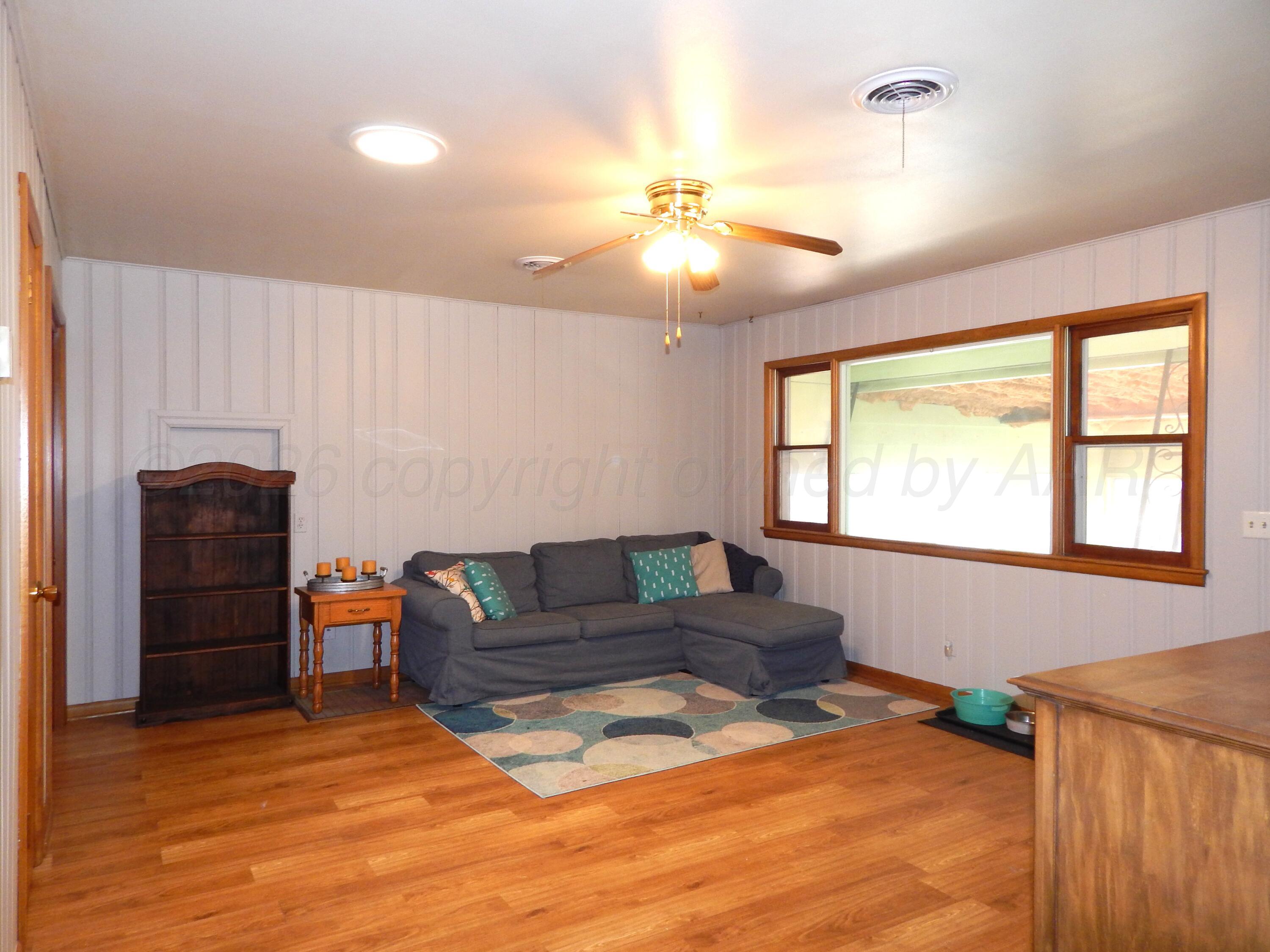 519 Third Street McLean, TX 79057 - Photo 12 of 19 a living room with furniture and a window