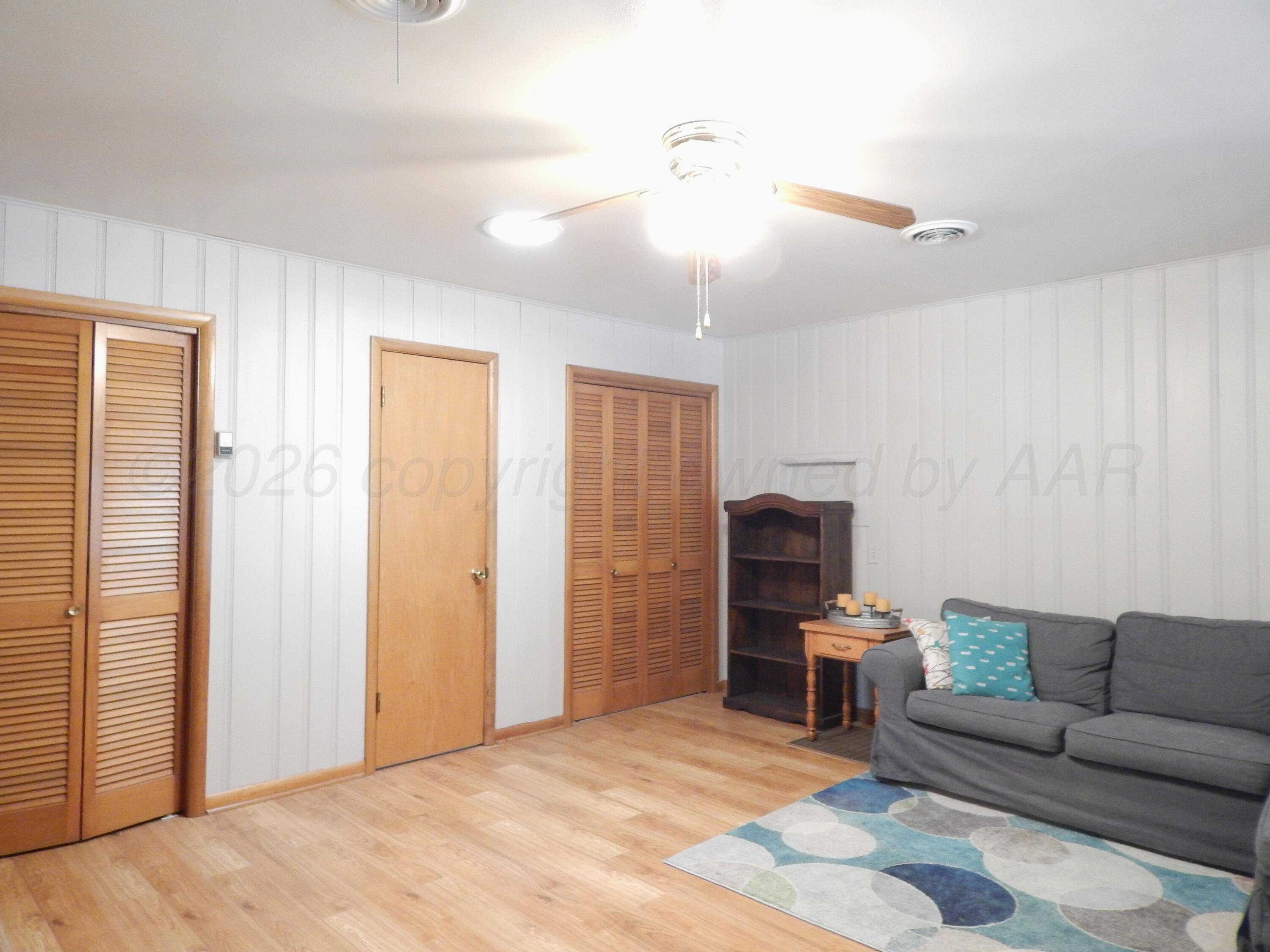 519 Third Street McLean, TX 79057 - Photo 13 of 19 a living room with furniture and a flat screen tv