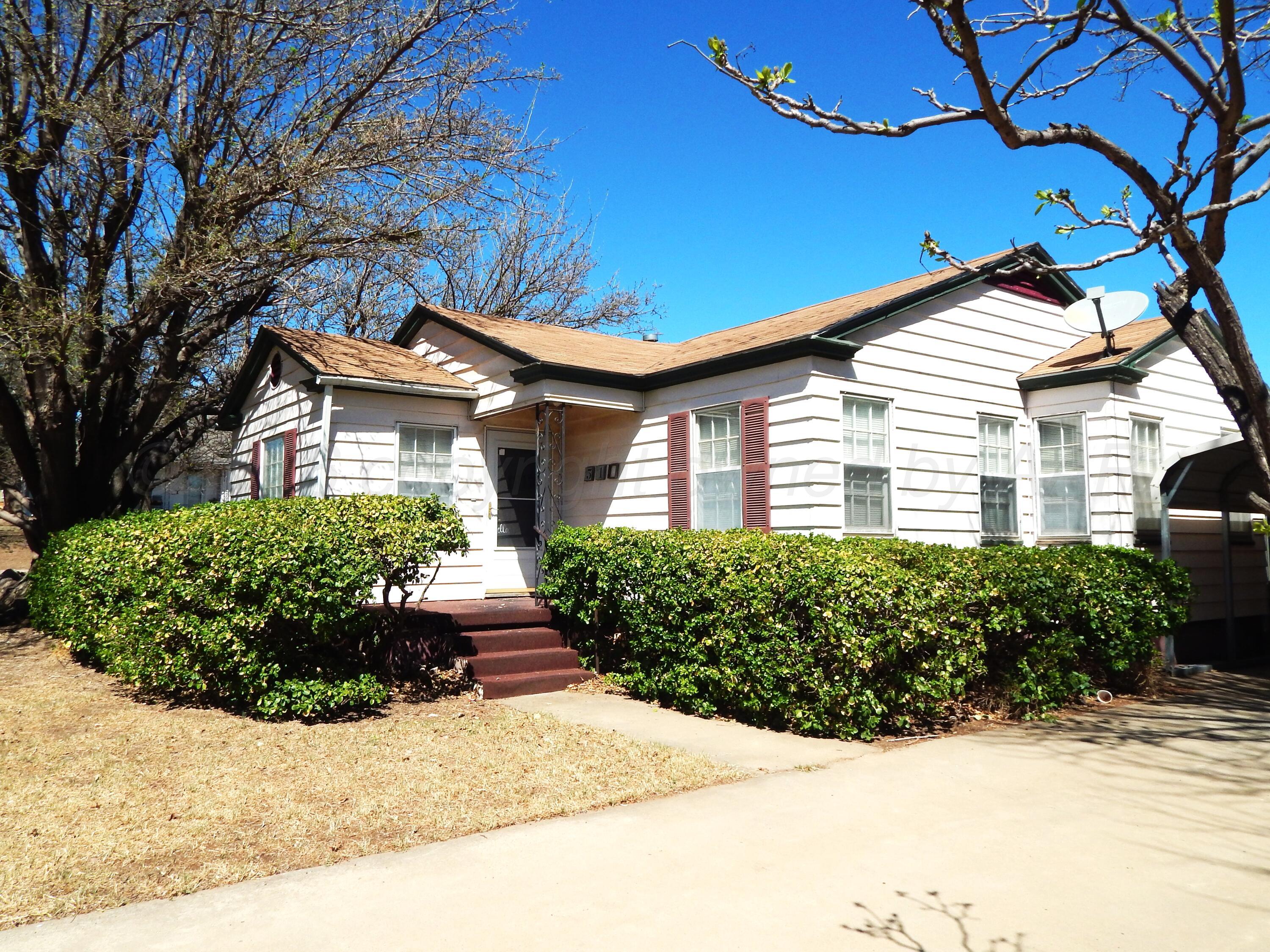 519 Third Street McLean, TX 79057 - Photo 19 of 19 a front view of a house with garden