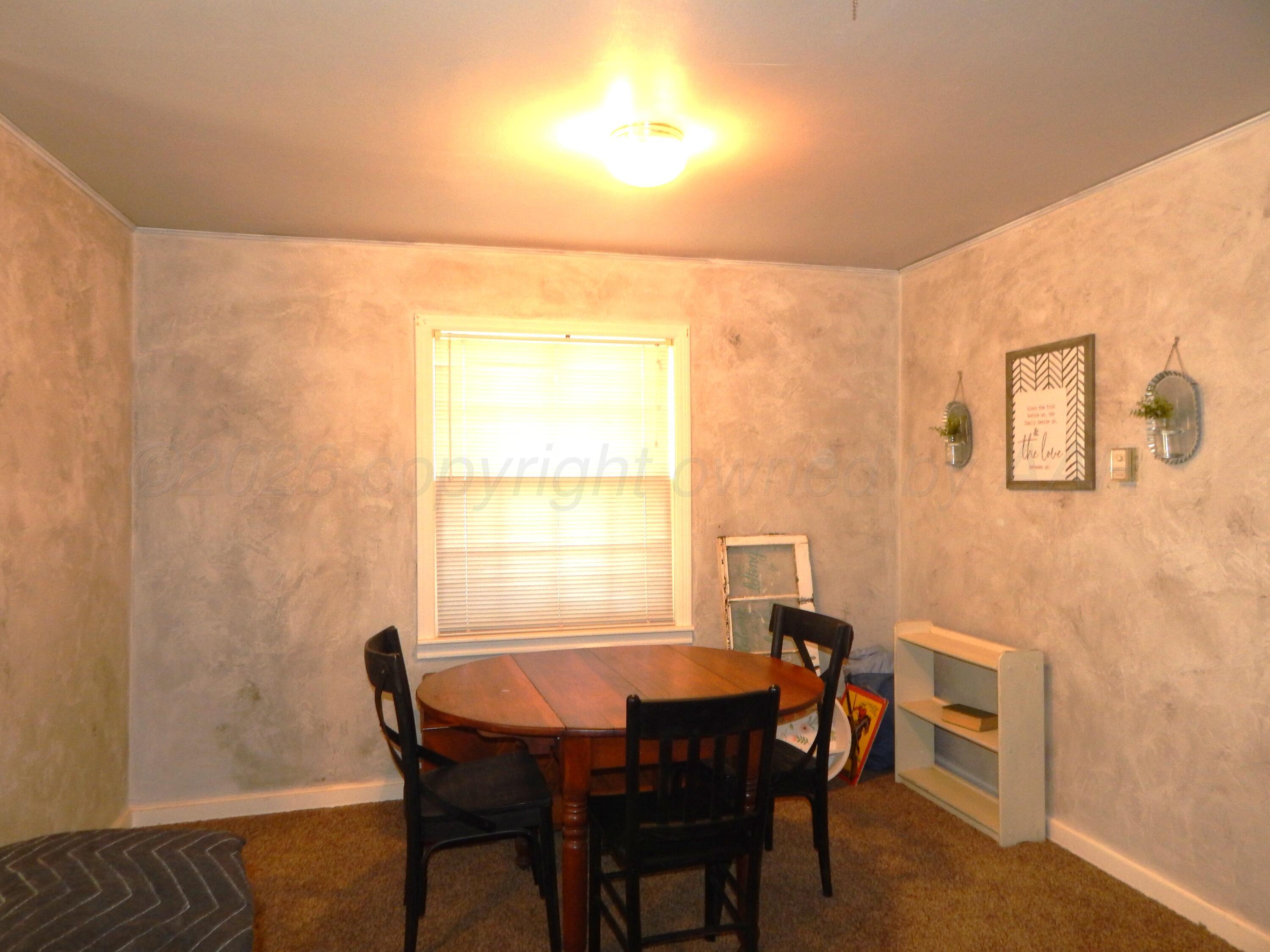 519 Third Street McLean, TX 79057 - Photo 3 of 19 a dining room with furniture and window