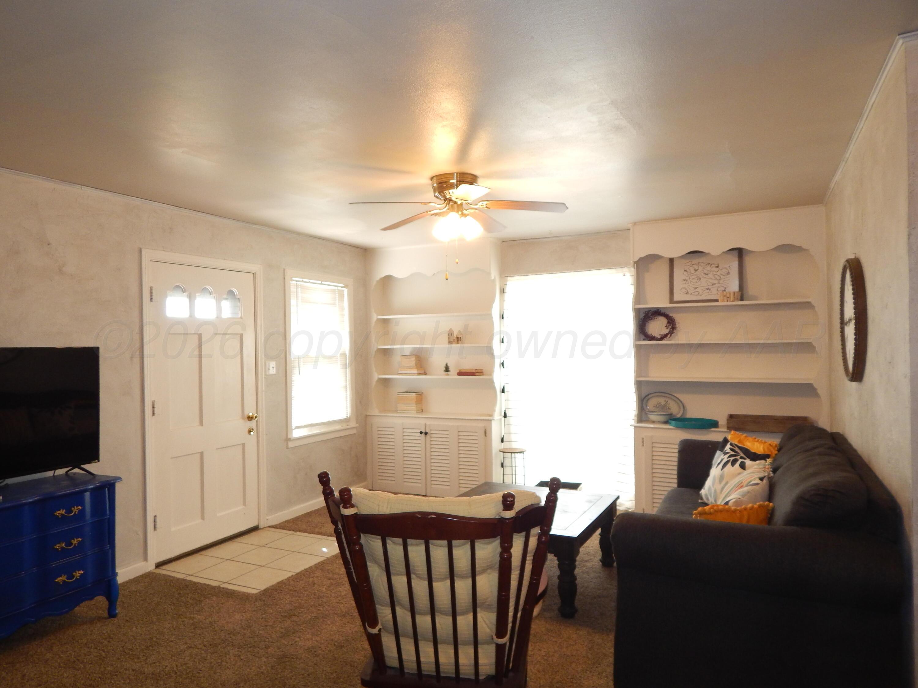 519 Third Street McLean, TX 79057 - Photo 4 of 19 a living room with furniture and a flat screen tv