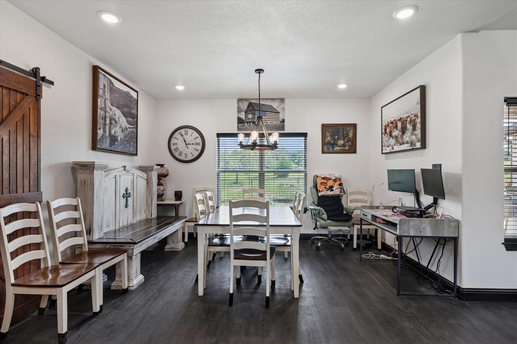403 Polk Road Bowie, TX 76230 - Photo 11 of 36 Dining room with dark wood-type flooring, a chandelier, recessed lighting, and an office area