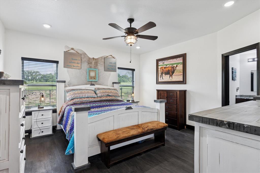 403 Polk Road Bowie, TX 76230 - Photo 13 of 36 Bedroom with multiple windows, dark wood finished floors, recessed lighting, and a ceiling fan
