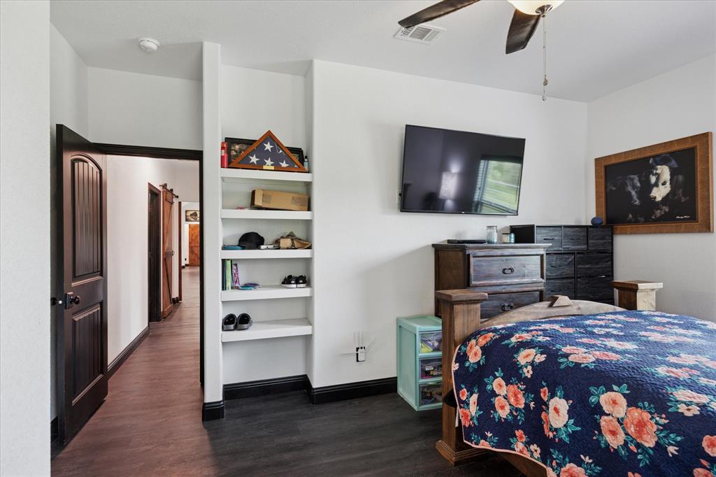 403 Polk Road Bowie, TX 76230 - Photo 20 of 36 Bedroom with dark wood-style floors and ceiling fan