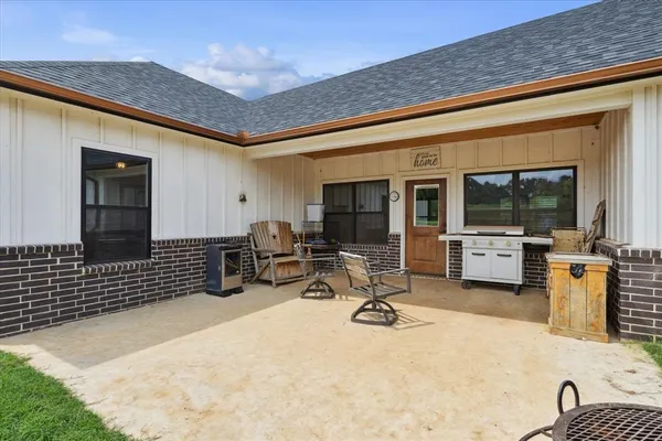 a view of a living room and a wooden deck