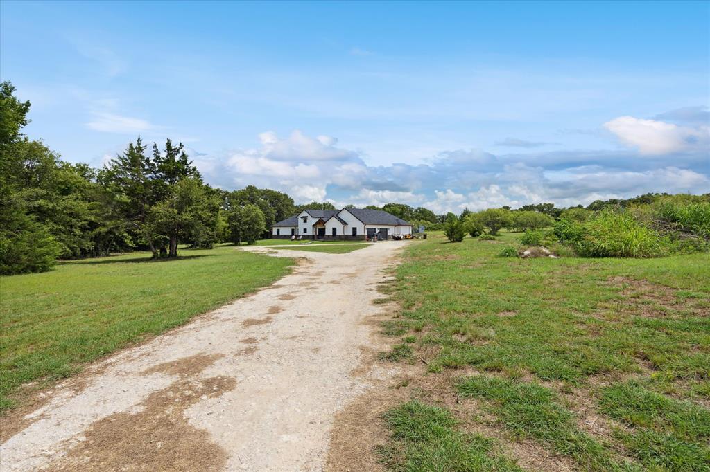 403 Polk Road Bowie, TX 76230 - Photo 3 of 36 View of dirt / gravel road