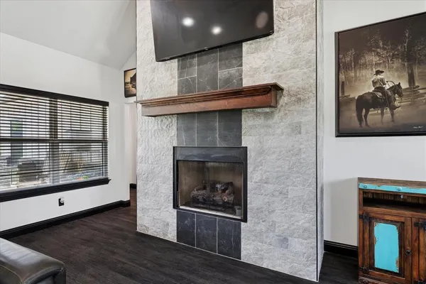 a hallway with a fireplace and a painting on the wall
