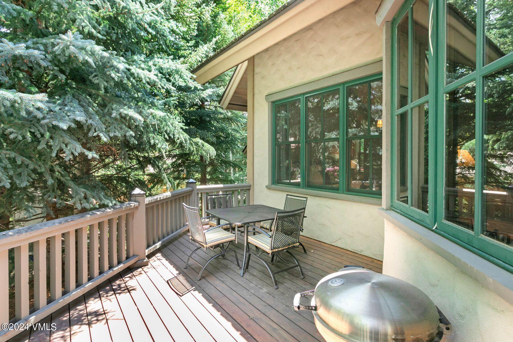 90 Riverbend Court, Unit E Edwards, CO 81632 - Photo 11 of 35 a balcony with wooden floor table and chairs