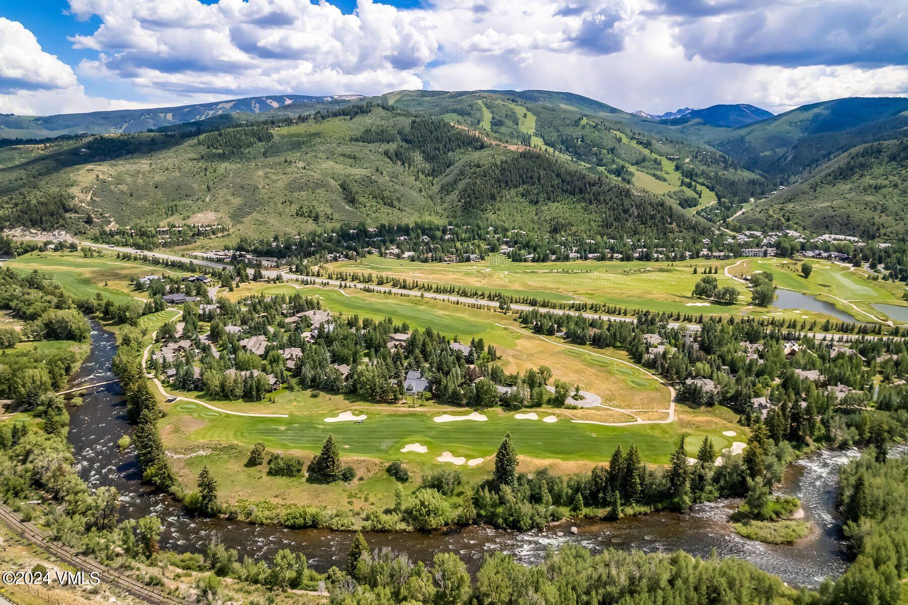 90 Riverbend Court, Unit E Edwards, CO 81632 - Photo 12 of 35 a view of a lake with a houses in the background