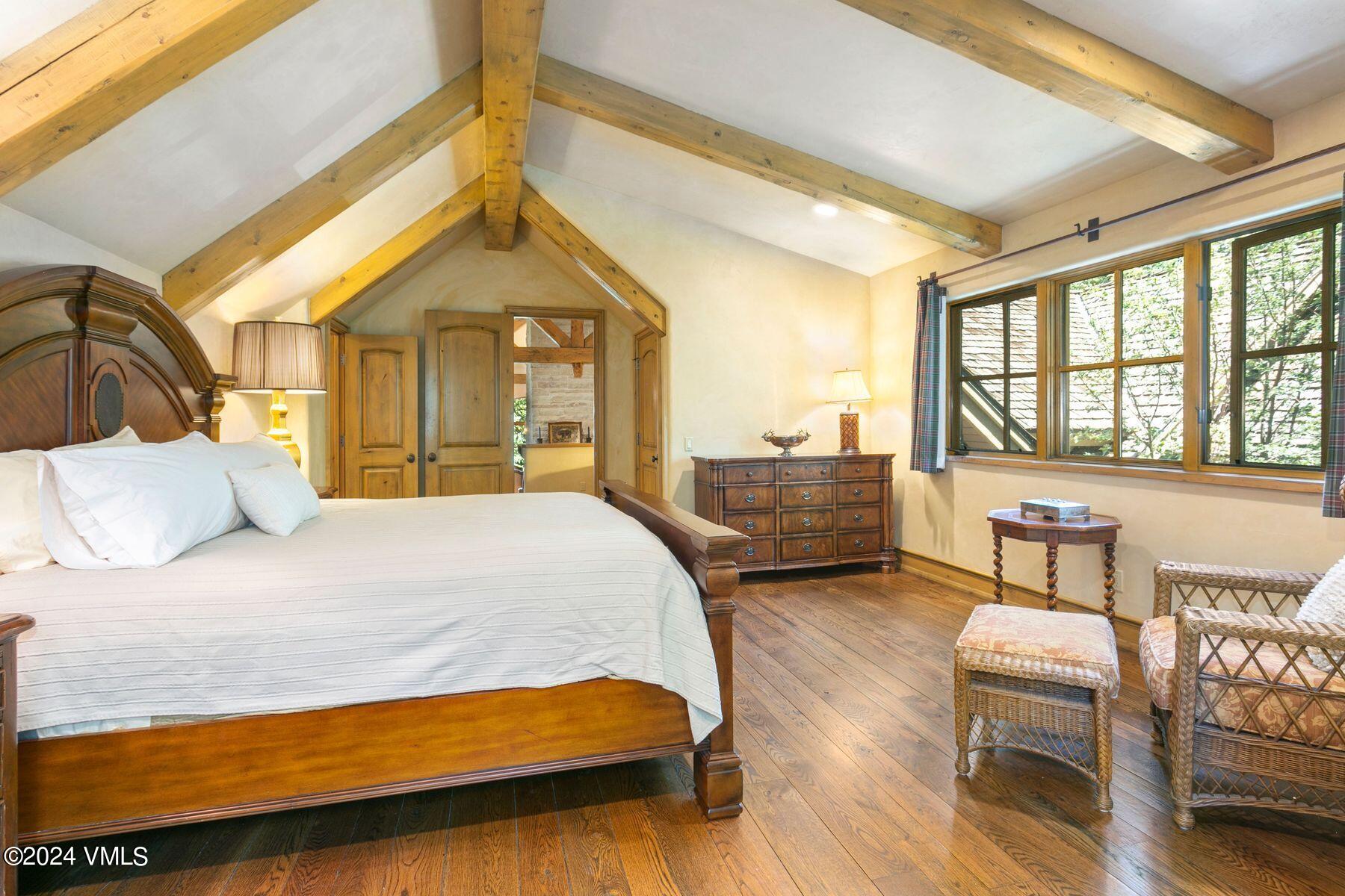 90 Riverbend Court, Unit E Edwards, CO 81632 - Photo 18 of 35 a bedroom with a bed and a dresser next to a window