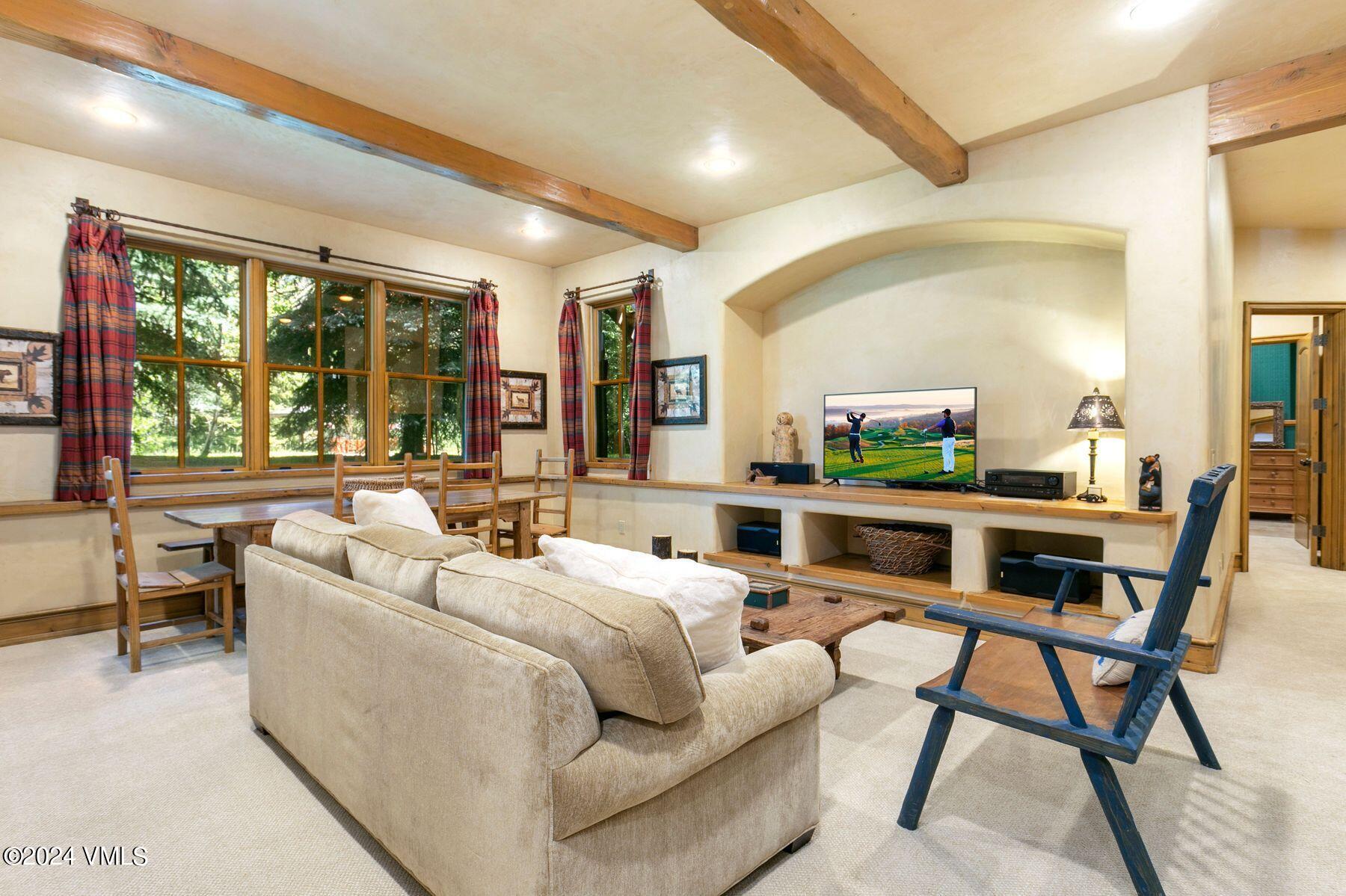 90 Riverbend Court, Unit E Edwards, CO 81632 - Photo 20 of 35 a living room with furniture and a open kitchen view