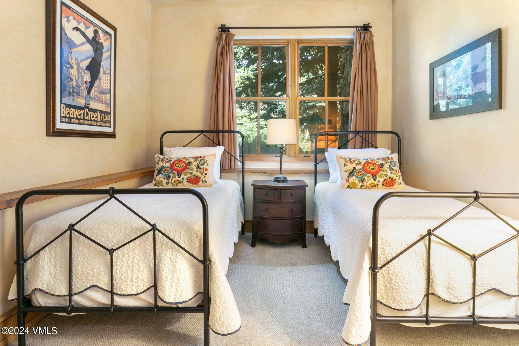 90 Riverbend Court, Unit E Edwards, CO 81632 - Photo 23 of 35 a bedroom with furniture and a window