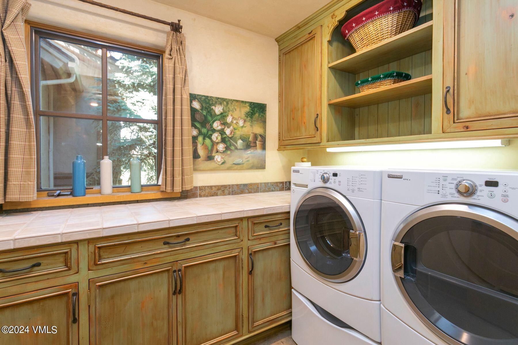 90 Riverbend Court, Unit E Edwards, CO 81632 - Photo 24 of 35 a utility room with dryer and washer