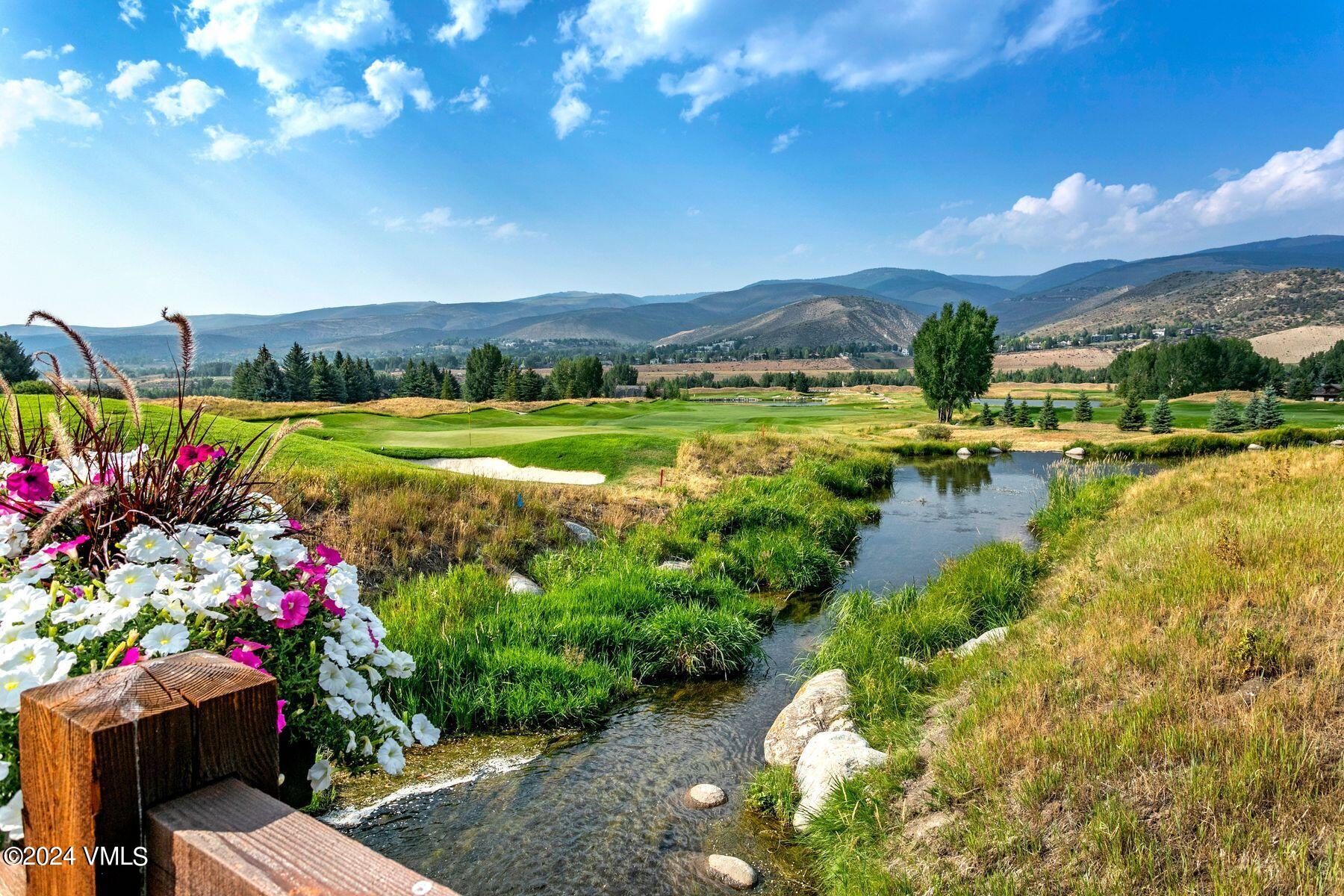 90 Riverbend Court, Unit E Edwards, CO 81632 - Photo 30 of 35 a view of a lake with a house in the background