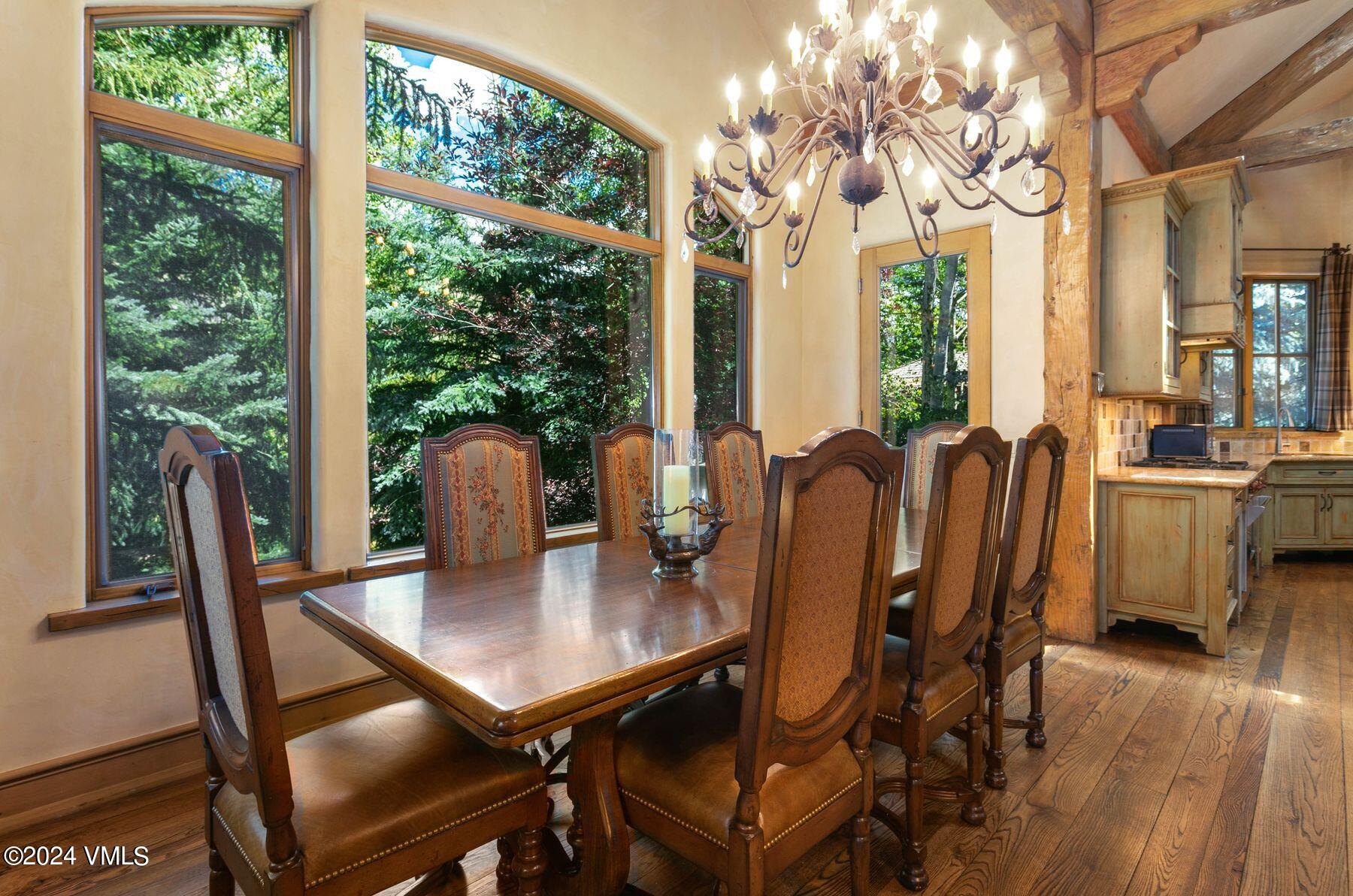90 Riverbend Court, Unit E Edwards, CO 81632 - Photo 7 of 35 a view of a dining room with furniture window and wooden floor