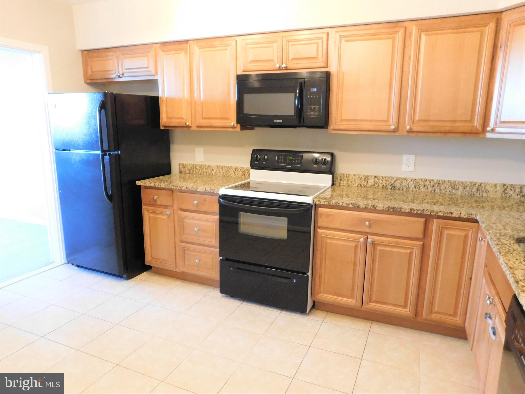 5501 Seminary Road, Unit 1006S Falls Church, VA 22041 - Photo 15 of 31 a kitchen with stainless steel appliances granite countertop a refrigerator stove and sink
