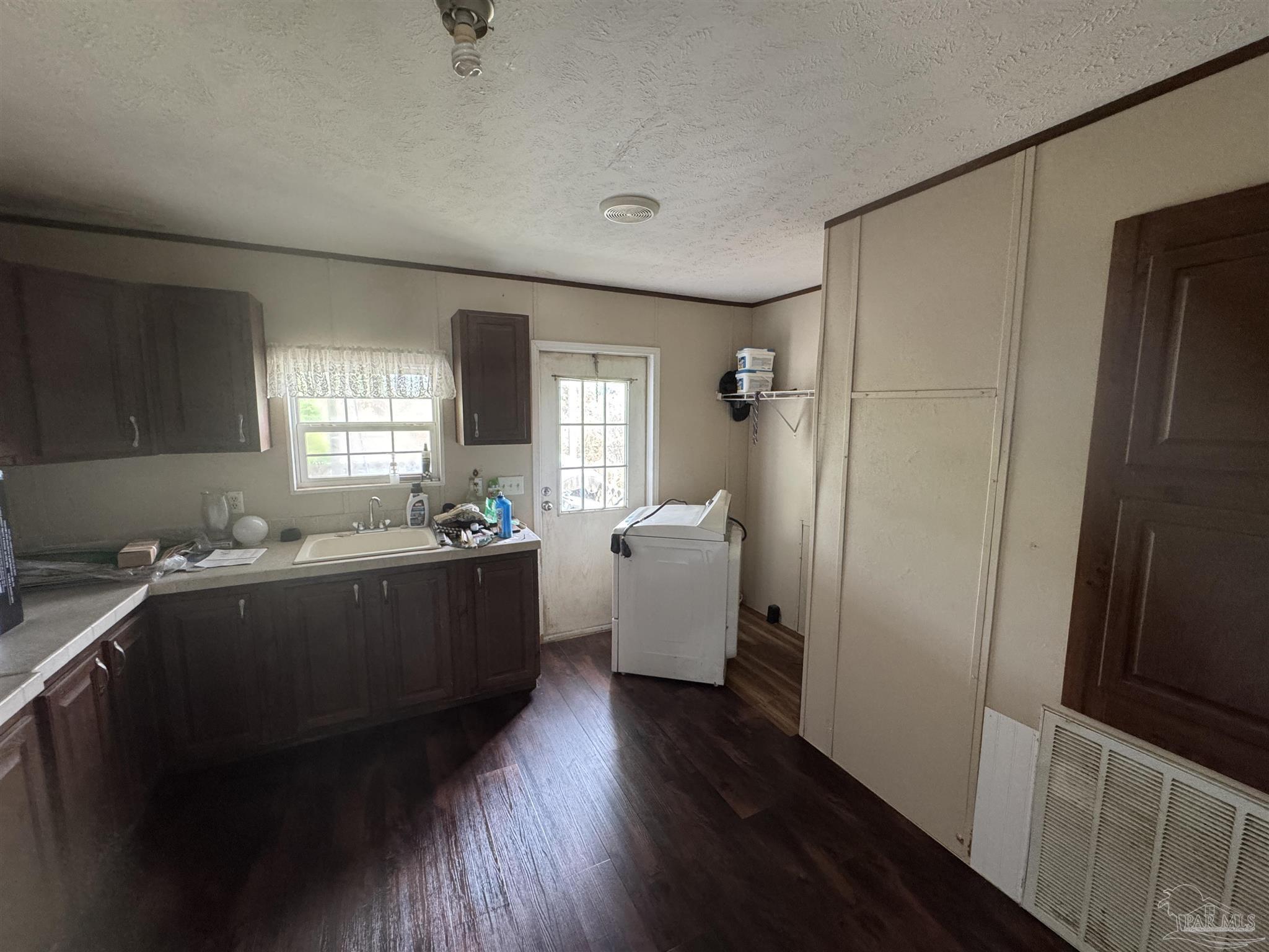 4508 Farm Life Road Milton, FL 32583 - Photo 11 of 20 a room with a window and wooden floor