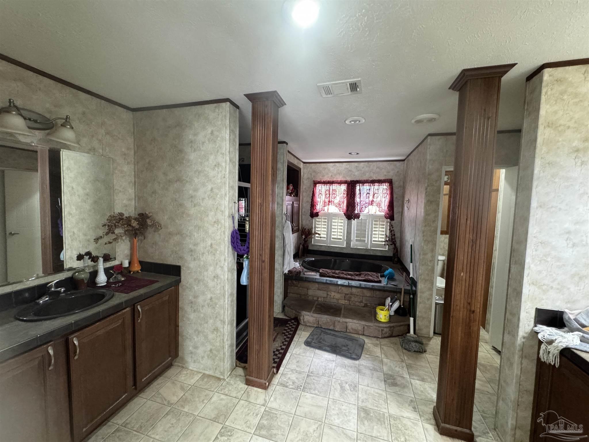 4508 Farm Life Road Milton, FL 32583 - Photo 4 of 20 a room with furniture and a mirror