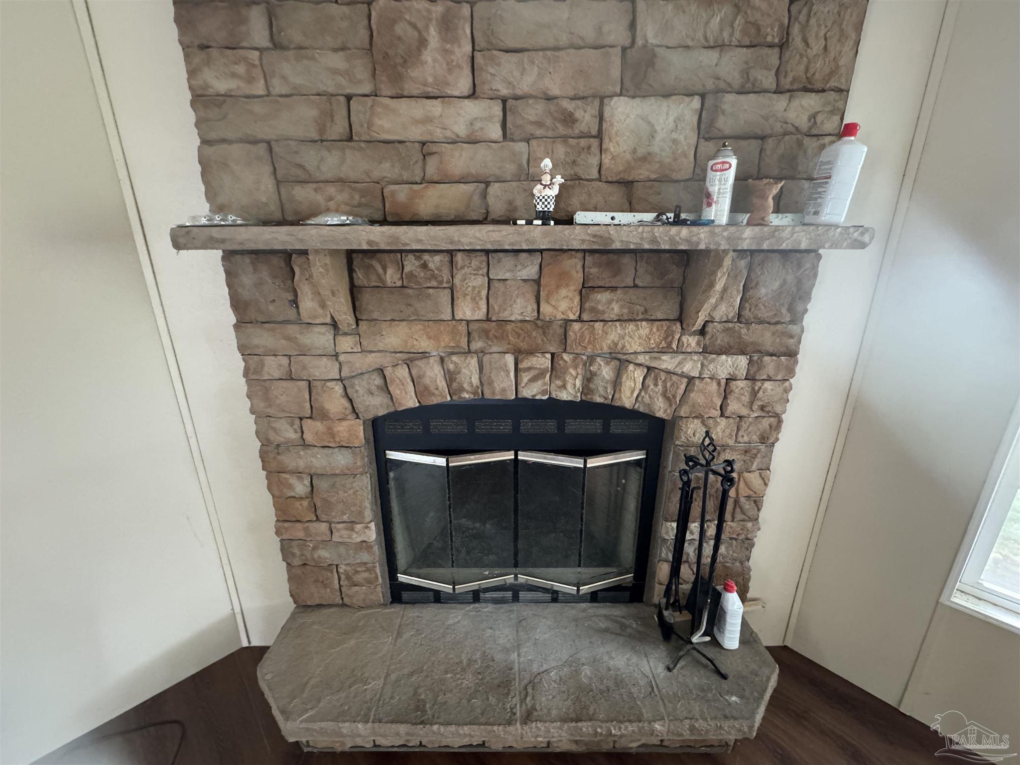 4508 Farm Life Road Milton, FL 32583 - Photo 7 of 20 a room with fireplace