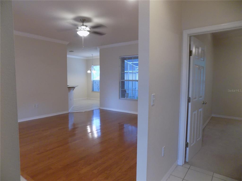 11903 Northwest 9 Road Gainesville, FL 32606 - Photo 12 of 60 a view of a livingroom with a ceiling fan window and hardwood floor